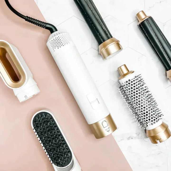 "5-in-1 hair styler with air tech, five attachments, sleek silver design for curling, drying, smoothing, volumizing."