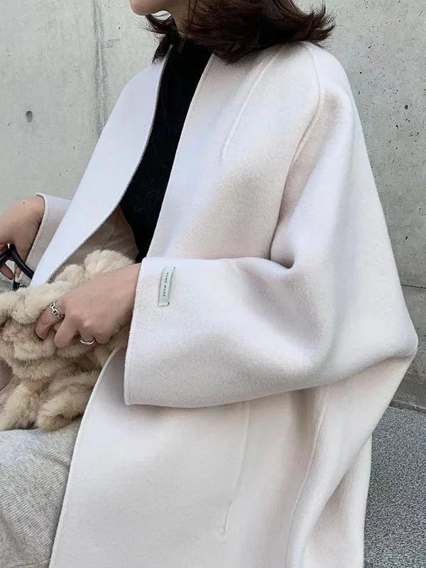 Women's chic long winter coat, an essential piece for effortless elegant fashion & warmth.