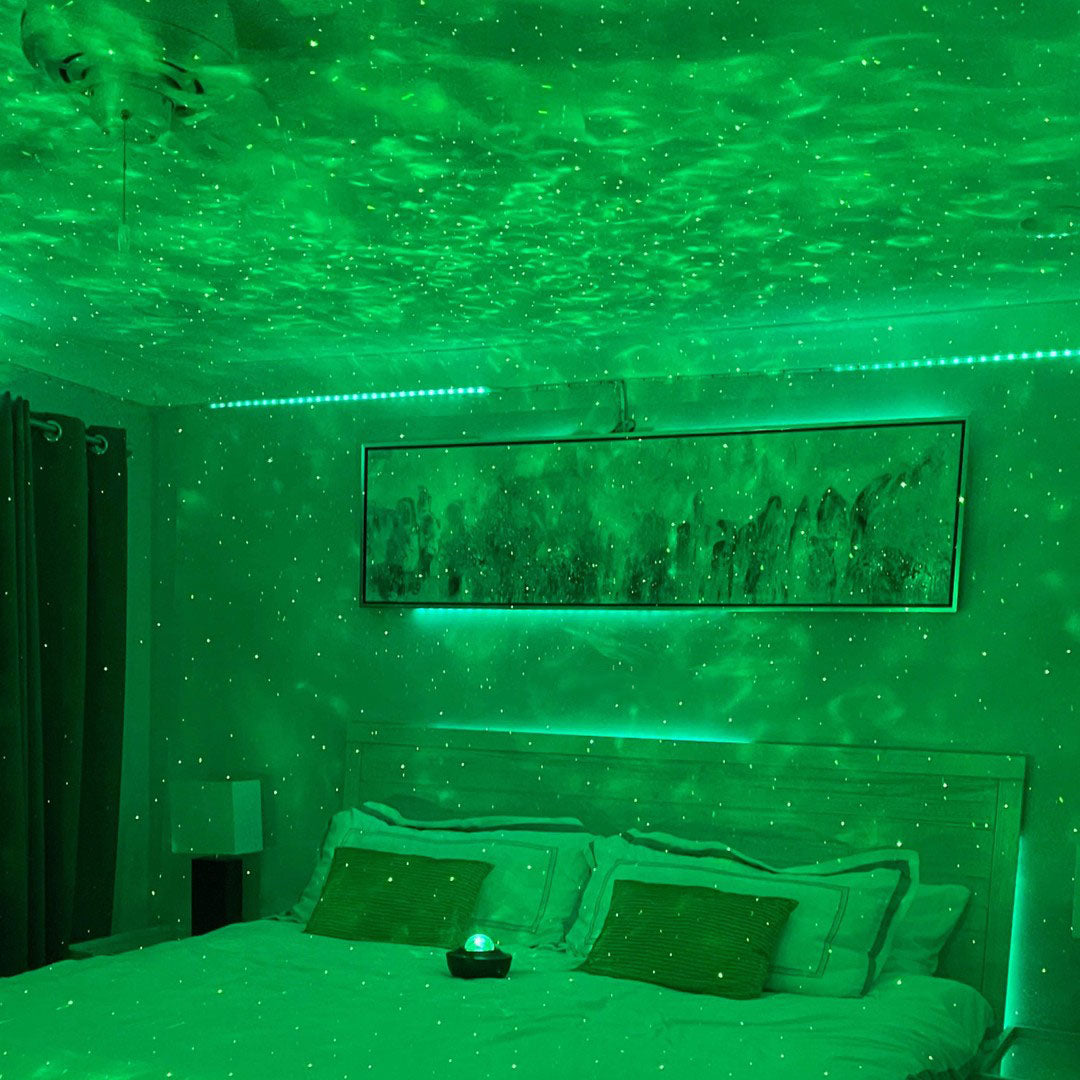 Vibrant Star Light Projector displaying colorful galaxies and nebulae on a ceiling.