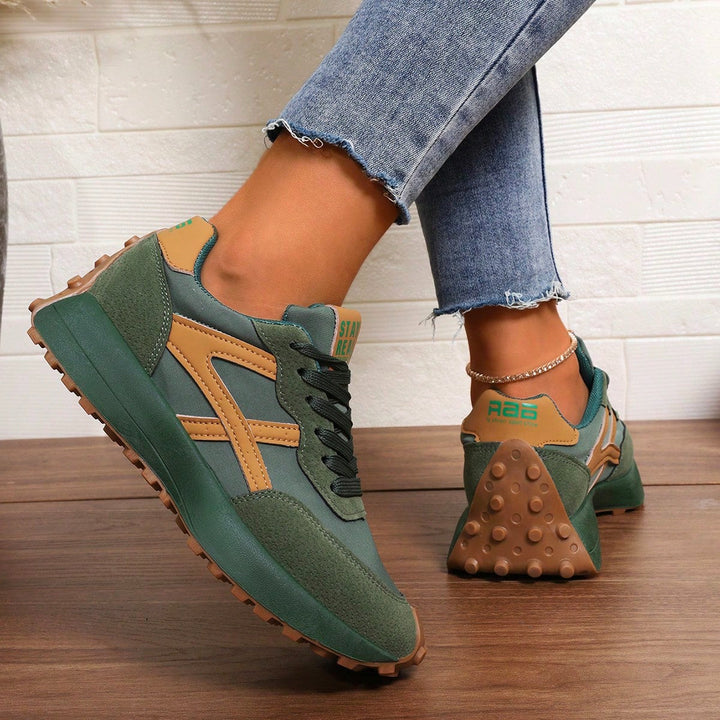 Comfort-focused wide fit trainers for women with orthopedic features.