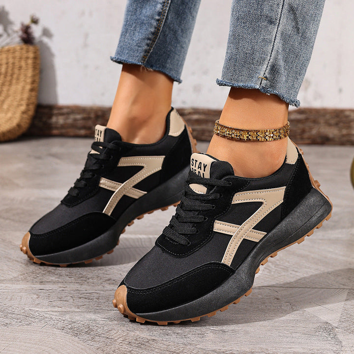 Slip-resistant women's wide fit sneakers, designed for comfort & safety.
