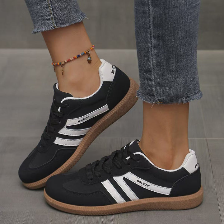 Women's orthopedic wide fit lace-up trainers, offering cushioned arch support.