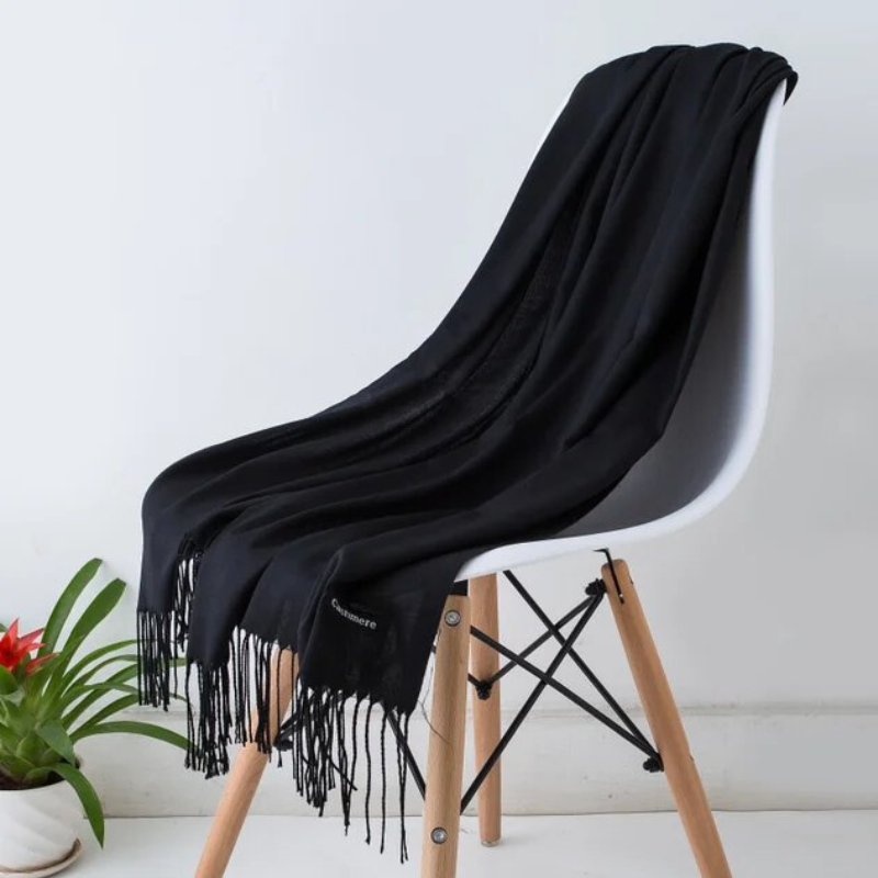 Deluxe women's cashmere blend wrap, oversized for cozy fall/winter style.