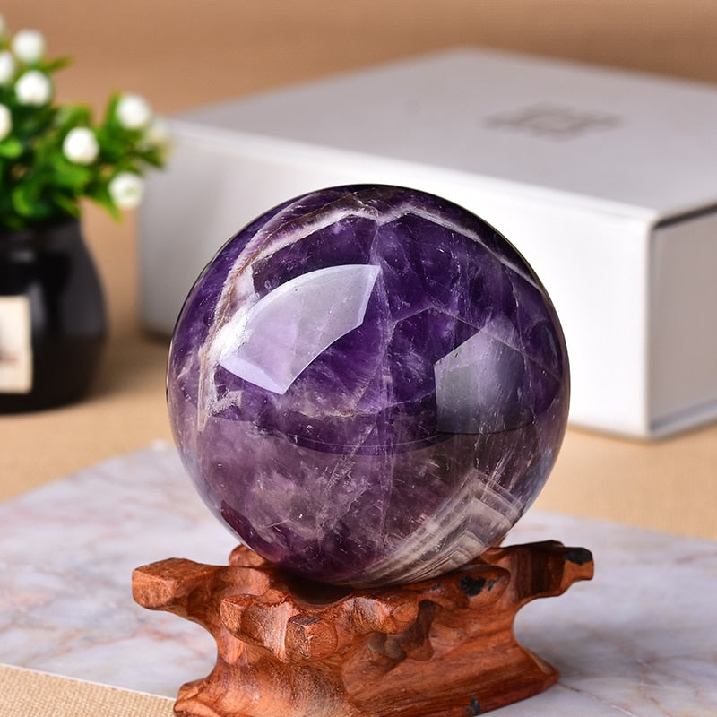 Amethyst crystal sphere, elegant purple gemstone decor for living room & bedroom.