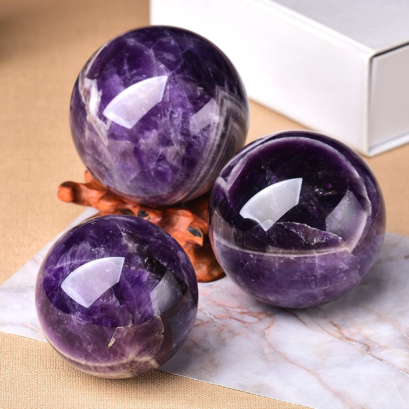 Natural amethyst sphere, decorative gemstone for unique home decor & energy.