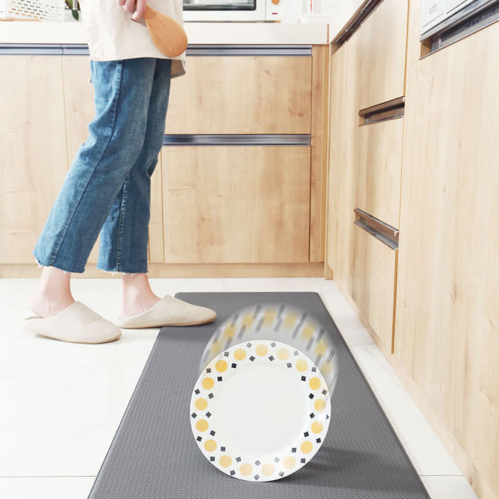 "Anti-slip waterproof kitchen rug with comfort cushioning, durable PVC, two-sided no-slip design, in grey rhombus pattern."