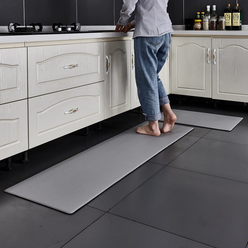 "Anti-slip waterproof kitchen rug with comfort cushioning, durable PVC, two-sided no-slip design, in grey rhombus pattern."
