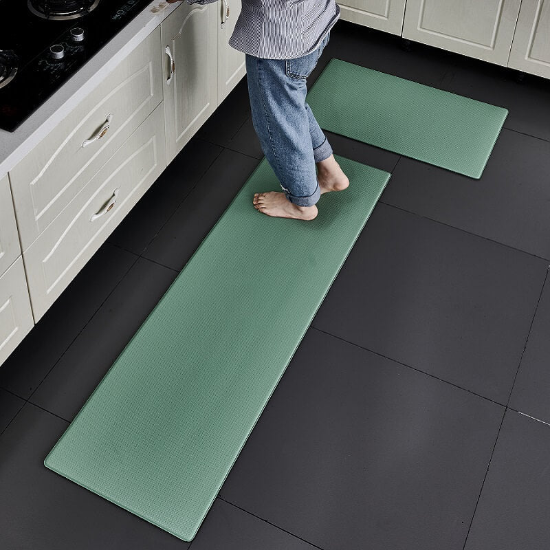 "Anti-slip waterproof kitchen rug with comfort cushioning, durable PVC, two-sided no-slip design, in grey rhombus pattern."