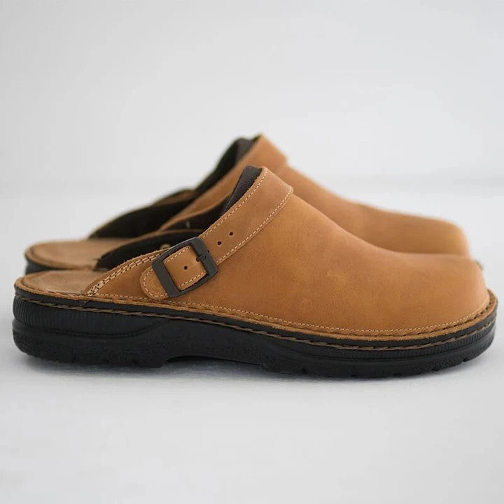 Dark brown men's slip-on clog mules with adjustable buckle for casual, rugged everyday wear.
