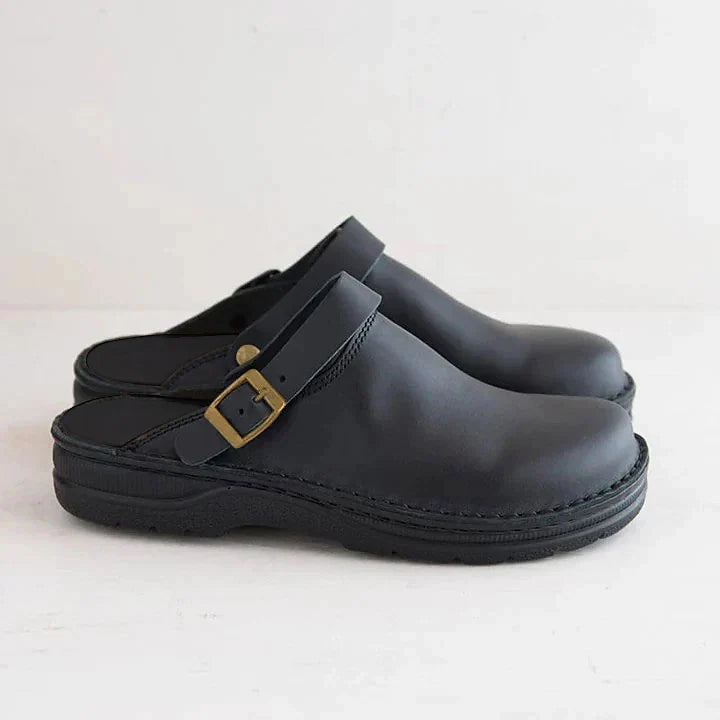 Black men's orthopedic clog mules, slip-on comfort footwear with adjustable buckle for support.