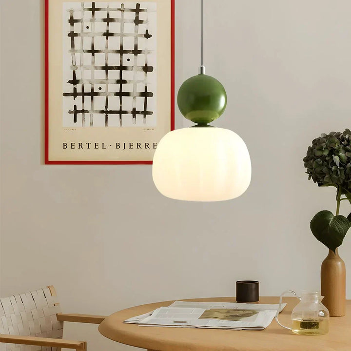 "Art Deco Cream Pendant Light with Bauhaus design, features high-quality metal frame and warm glow for elegant home lighting.