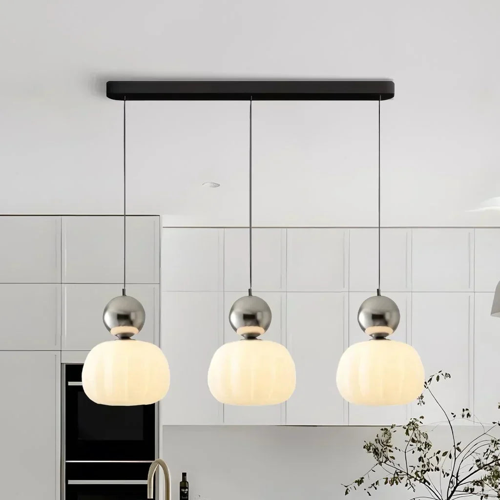 "Art Deco Cream Pendant Light with Bauhaus design, features high-quality metal frame and warm glow for elegant home lighting.