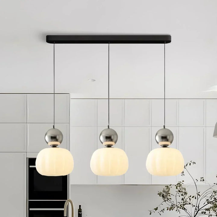"Art Deco Cream Pendant Light with Bauhaus design, features high-quality metal frame and warm glow for elegant home lighting.