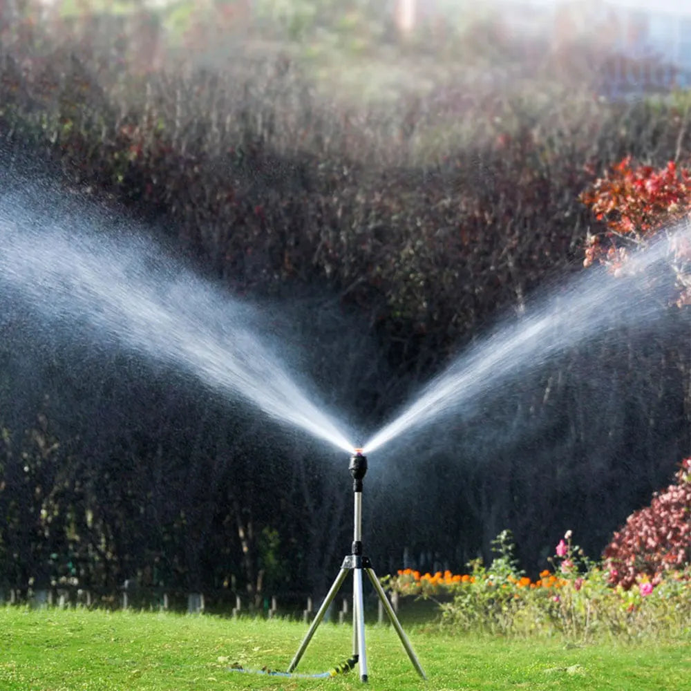 Automatic rotating garden sprinkler with adjustable tripod for customizable height, perfect for even water distribution.