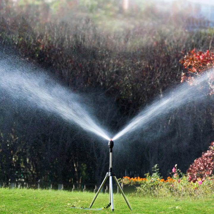 Automatic rotating garden sprinkler with adjustable tripod for customizable height, perfect for even water distribution.