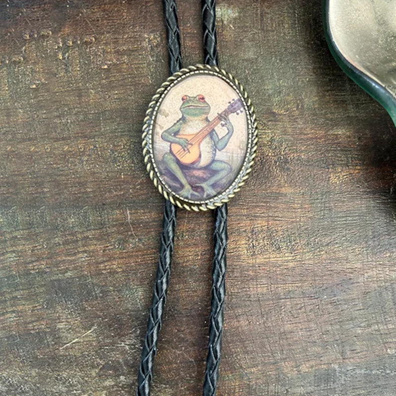 Make a statement with this novelty banjo frog bolo tie, a unique unisex western style accessory and fashion tie.