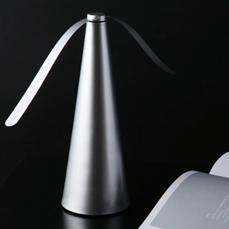 "Battery-operated fly repellent fan with sleek design for alfresco dining, featuring innovative light-bending technology."