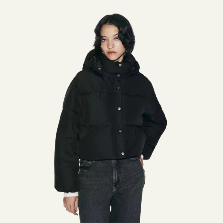 Black lightweight women's puffer jacket, warm and insulated winter coat. Essential cold weather outerwear.