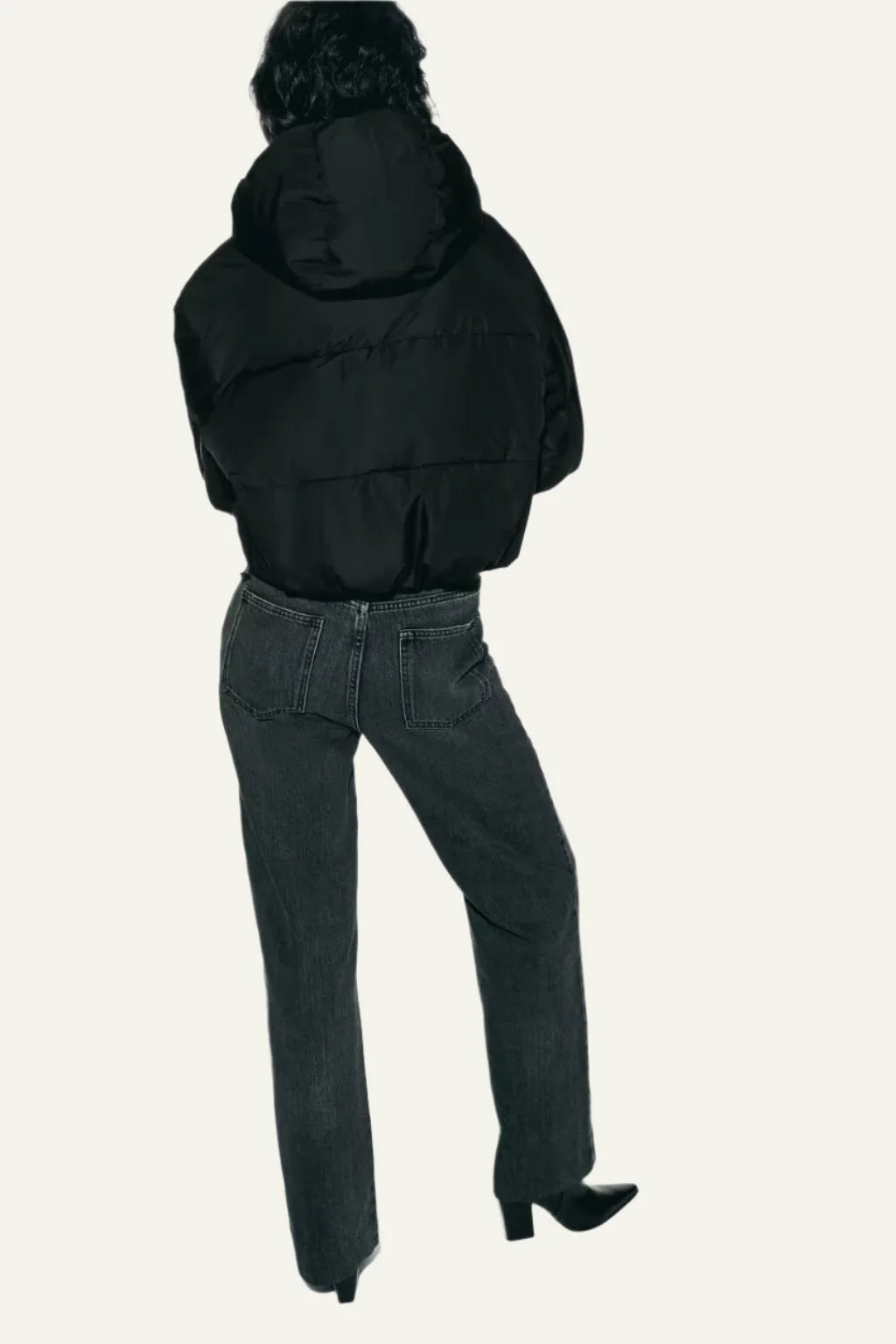 Versatile black puffer jacket for women. Fashionable & warm winter outerwear, ideal for daily wear.