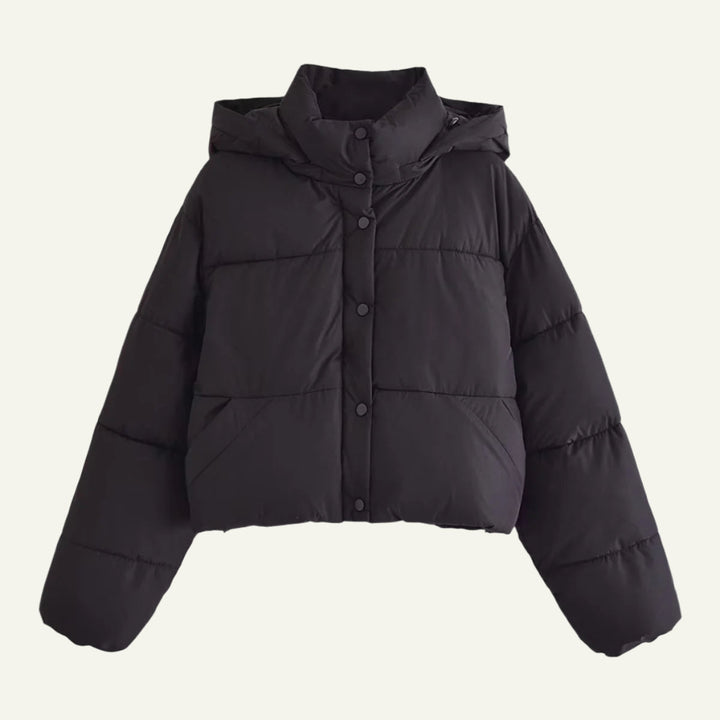 Stylish women's black puffer jacket. Insulating, lightweight design for a warm and sleek winter look.