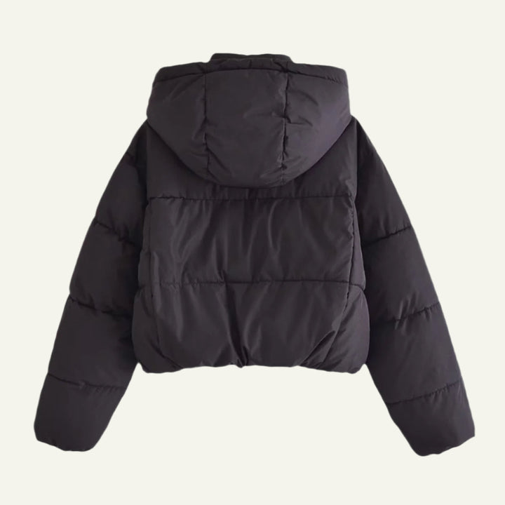 Durable black puffer jacket for women. Offers lightweight warmth and insulation for harsh winter conditions.