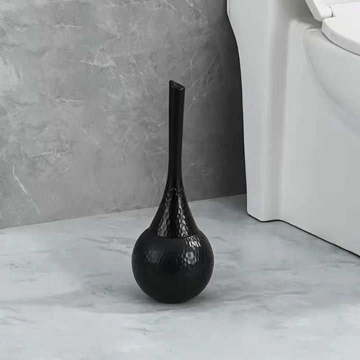 Premium toilet brush with modern design and discreet holder, enhancing luxury bathrooms and home hygiene.