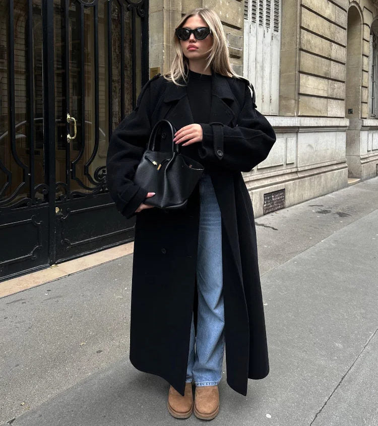 Black oversized maxi trench coat for women with a stylish belt, perfect for fall/winter elegance.