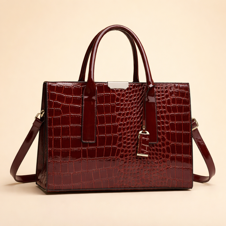 Elegant red women's tote bag. Structured, crocodile pattern luxury handbag for fashion-forward daily carry & work.