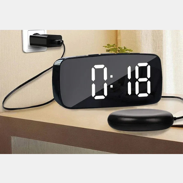 Stylish black bedroom vibrating alarm clock with a strong bed shaker for effective wake-ups.