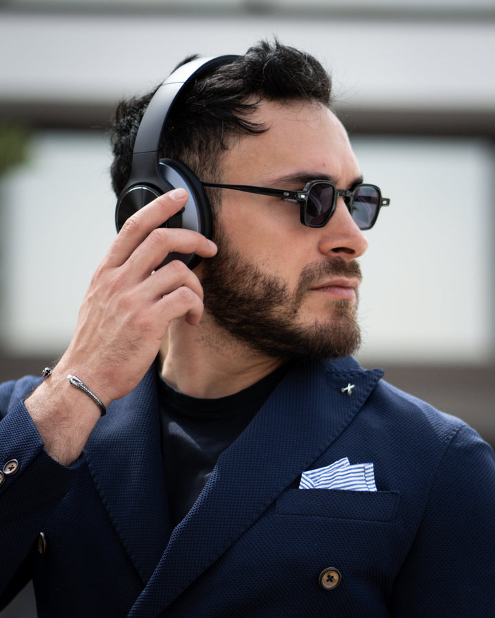 Black wireless over-ear headphones with Bluetooth and hybrid active noise cancellation, featuring memory foam earcups and USB