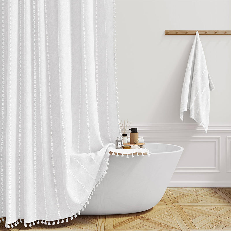 "Bohemian farmhouse waterproof linen shower curtain with decorative tassels, shown in a warm beige plaid pattern."