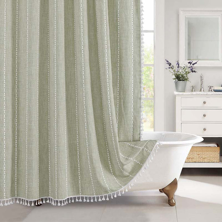 "Bohemian farmhouse waterproof linen shower curtain with decorative tassels, shown in a warm beige plaid pattern."