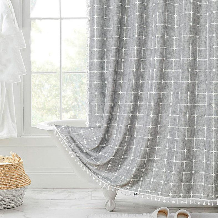 "Bohemian farmhouse waterproof linen shower curtain with decorative tassels, shown in a warm beige plaid pattern."