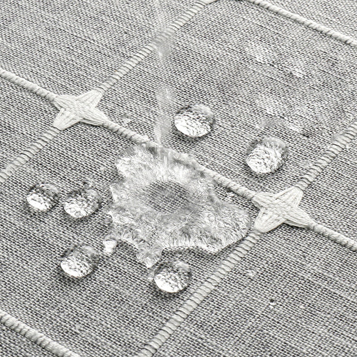 "Bohemian farmhouse waterproof linen shower curtain with decorative tassels, shown in a warm beige plaid pattern."