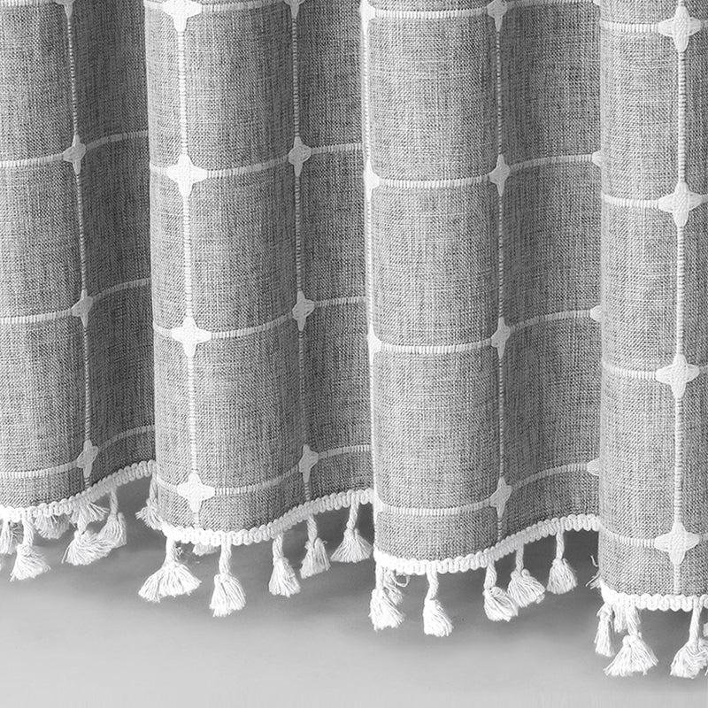 "Bohemian farmhouse waterproof linen shower curtain with decorative tassels, shown in a warm beige plaid pattern."