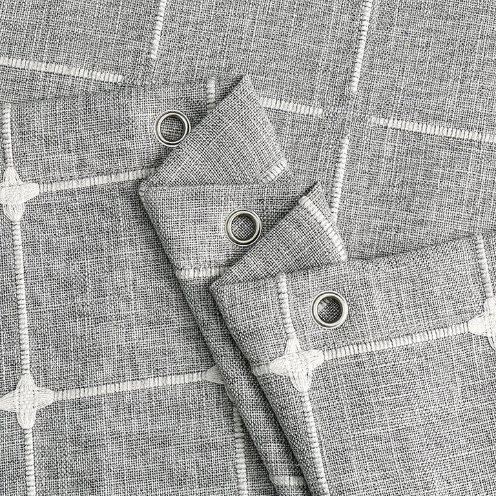 "Bohemian farmhouse waterproof linen shower curtain with decorative tassels, shown in a warm beige plaid pattern."