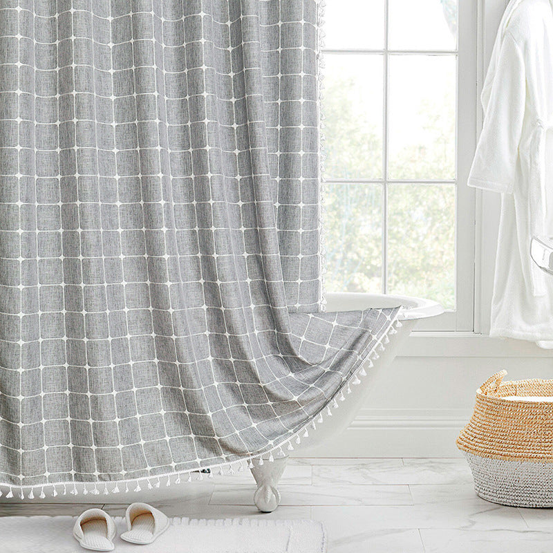 "Bohemian farmhouse waterproof linen shower curtain with decorative tassels, shown in a warm beige plaid pattern."