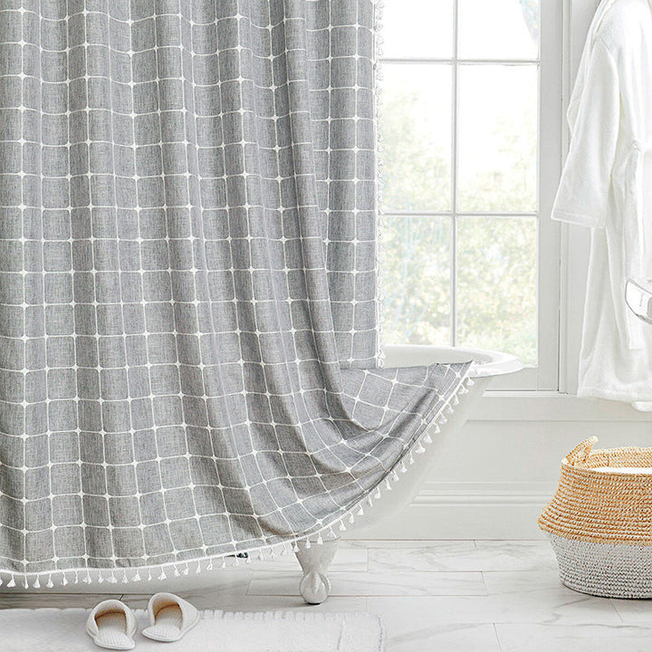 "Bohemian farmhouse waterproof linen shower curtain with decorative tassels, shown in a warm beige plaid pattern."