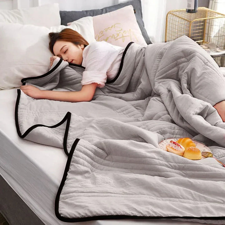 Breathable summer cooling blanket, a lightweight bamboo blend throw for heat relief & comfortable sleep.