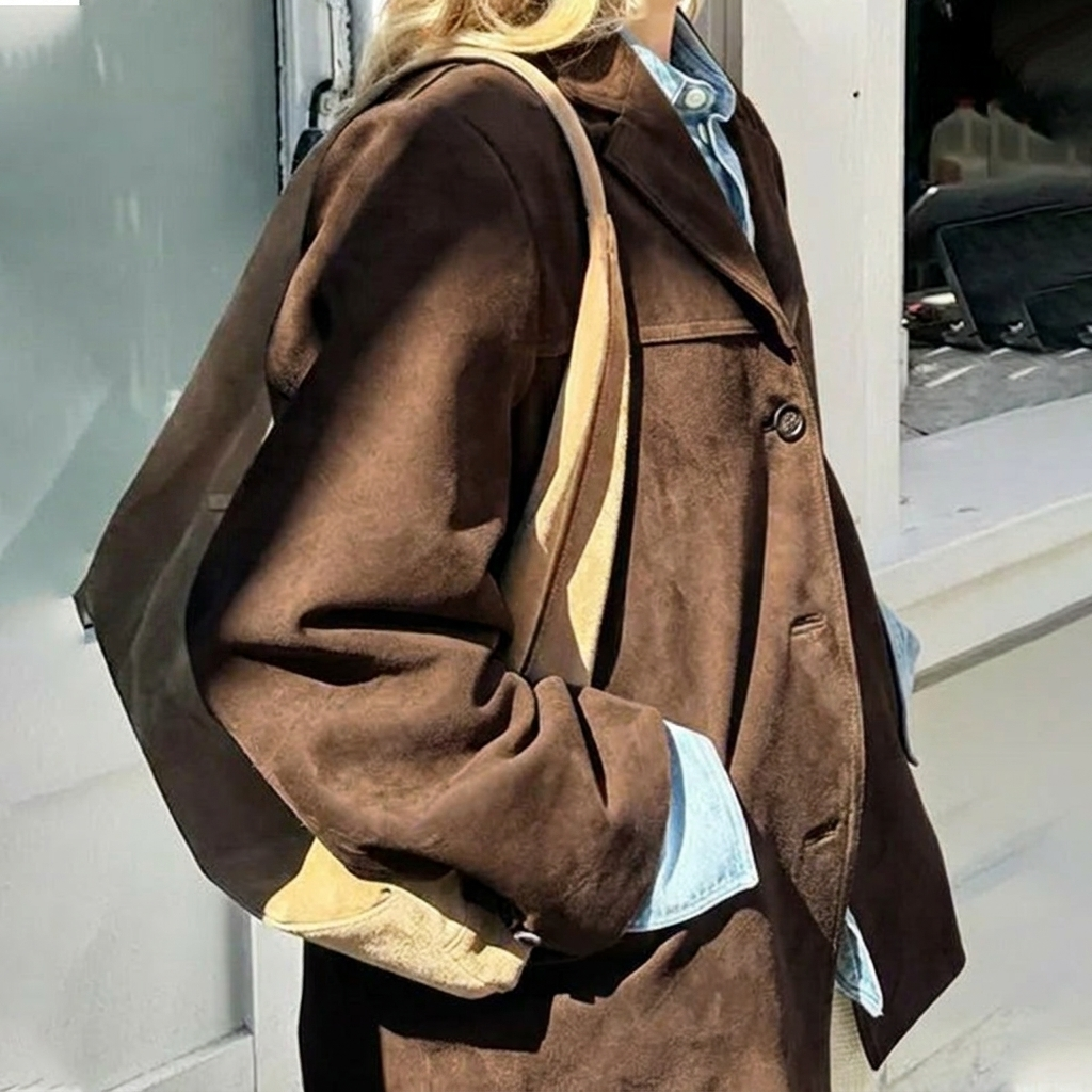 Comfortable women's oversized brown blazer with notched lapel. Button front, perfect for a modern casual chic look.