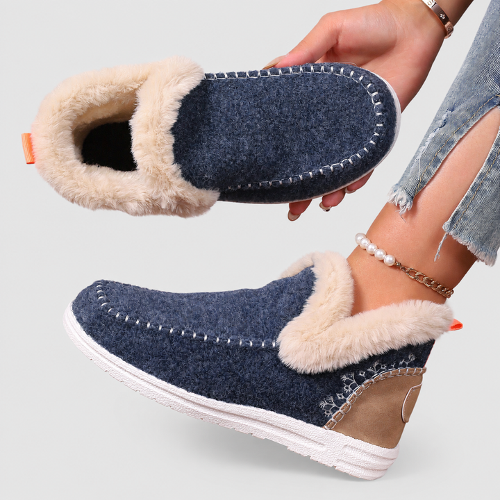 Everyday women's indoor slippers, providing warmth, plush comfort, and essential foot support.
