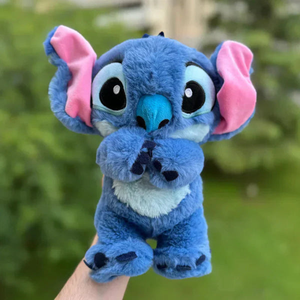 Calming plush toy with breathing simulation, soft and cuddly, anxiety relief; suitable for kids and adults, blue and pink.