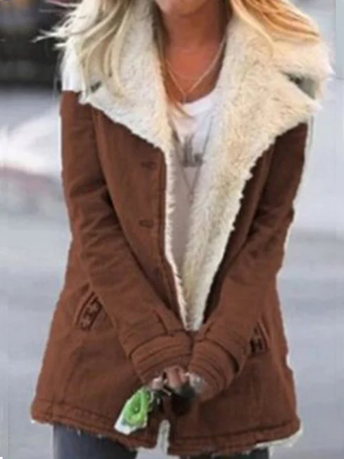 Woman wearing a Celeste cozy winter jacket. Stylish, warm outerwear for cold weather fashion.