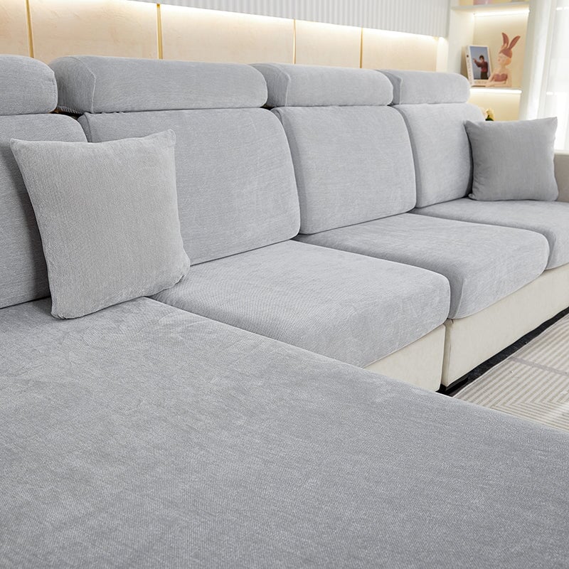 "Chenille sectional sofa cover in smoke color, fits snugly on sectional sofas to protect against wear, spills, and stains."