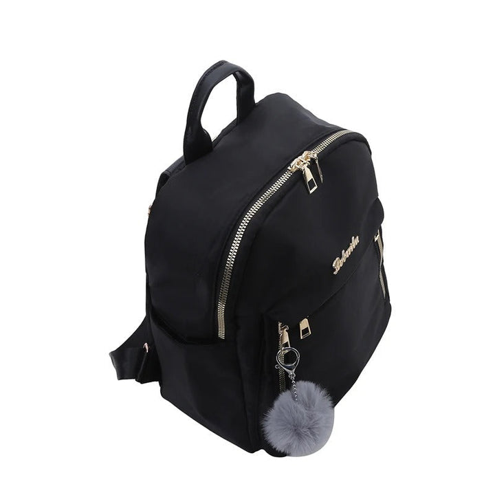 Durable women's PU leather daily backpack, sleek black finish, great for students and professionals.