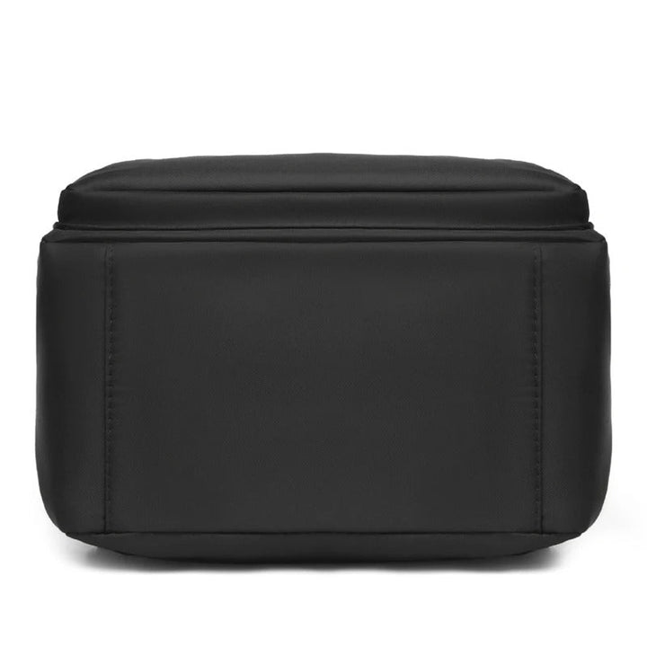 Modern women's PU leather backpack, black, offering a chic look for urban travel and school.