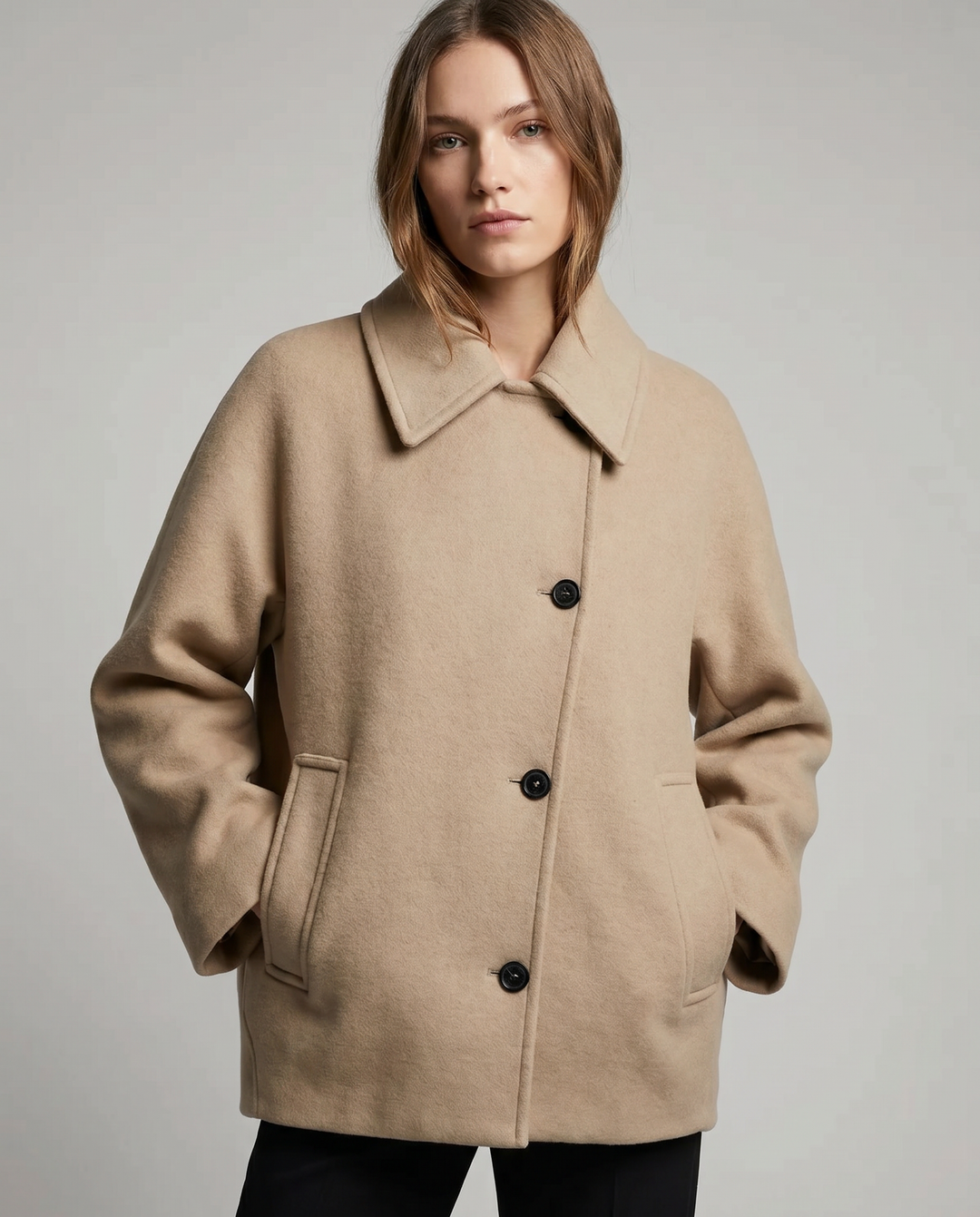Chic black women's short coat for elegant layering. Stylish outerwear jacket, modern & sophisticated.