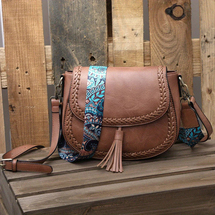 Elegant women's small shoulder bag with tassel, perfect for everyday chic style.