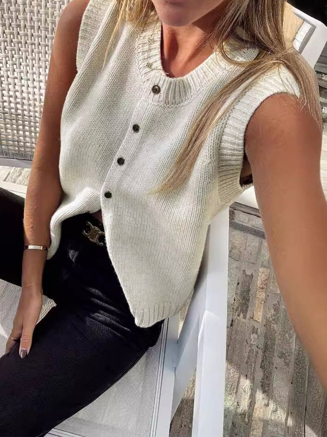 Sleeveless knit button-up vest for women, ideal for chic layering in spring & autumn fashion. Light grey.