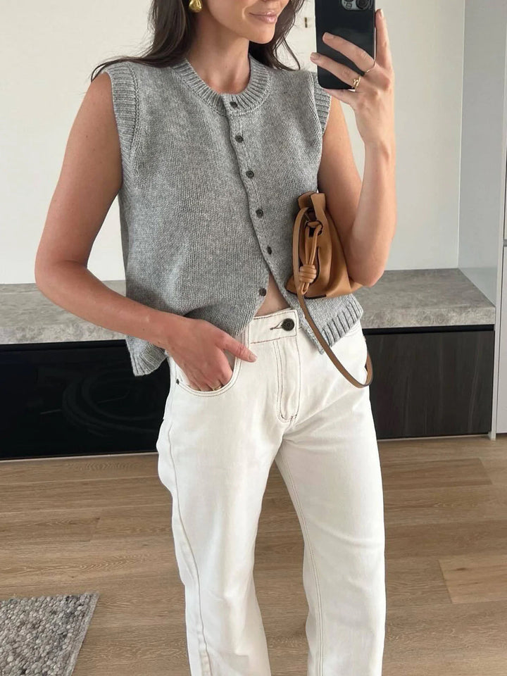 Chic women's button-up sweater vest, a sleeveless knit top in light grey, perfect for layering outfits.
